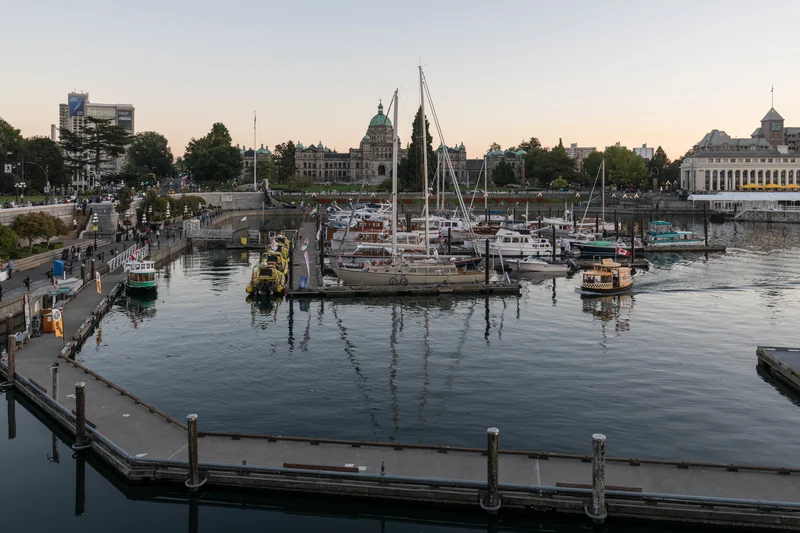 Boats in Victoria’s Inner Harbour with the Parliament Buildings beyond the waterfront